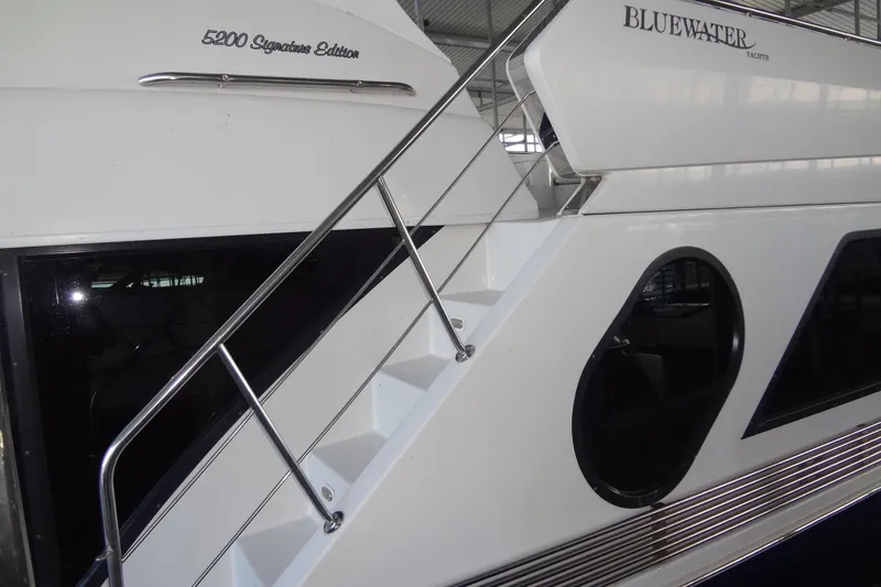 Slide: The Image of 2008 Bluewater 5200 Signature Edition yacht with sleek design and modern features. - 5