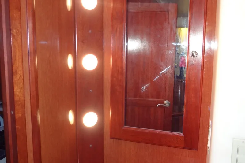 Slide: The Image of Wooden interior of 2008 Bluewater 5200 Signature Edition yacht with illuminated panel. - 55