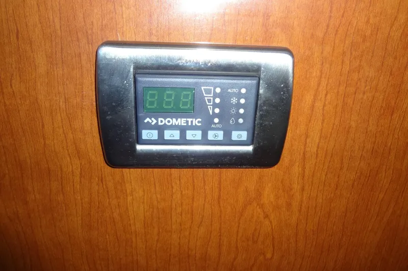 Slide: The Image of Dometic control panel on 2008 Bluewater 5200 Signature Edition yacht interior. - 57