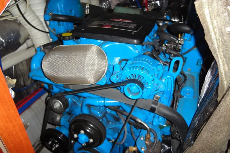 Slide: The Image of Engine of 2008 Bluewater 5200 Signature Edition boat, featuring vibrant blue components. - 59