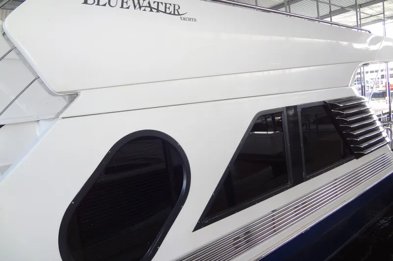 Slide: The Image of 2008 Bluewater 5200 Signature Edition yacht, side view with sleek windows and modern design. - 6