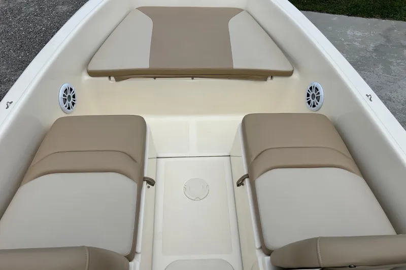 Slide: The Image of 2021 Scout 175 Dorado boat interior with beige seating and speakers. - 10