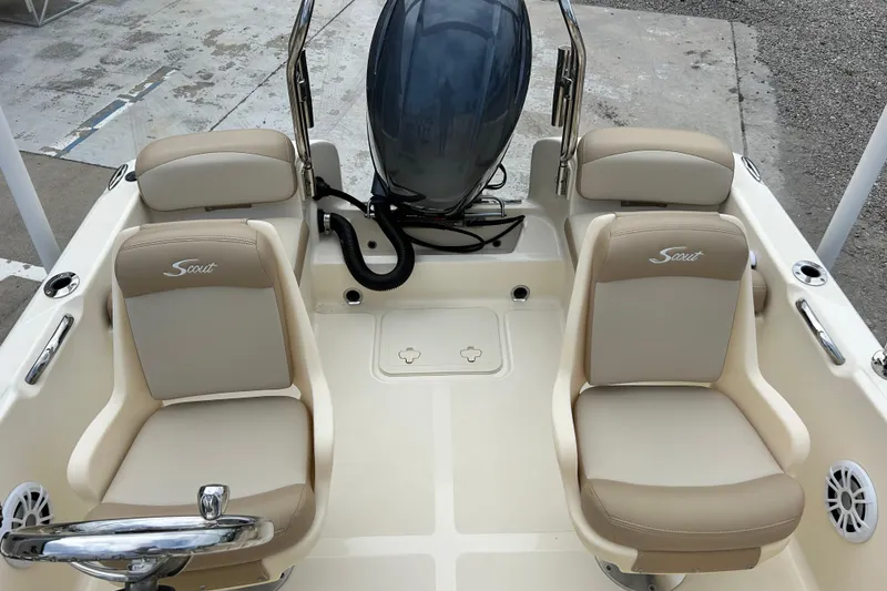 Slide: The Image of 2021 Scout 175 Dorado boat interior with beige seating and steering wheel. - 13