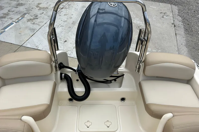 Slide: The Image of 2021 Scout 175 Dorado boat interior with Yamaha outboard motor and beige seating. - 14