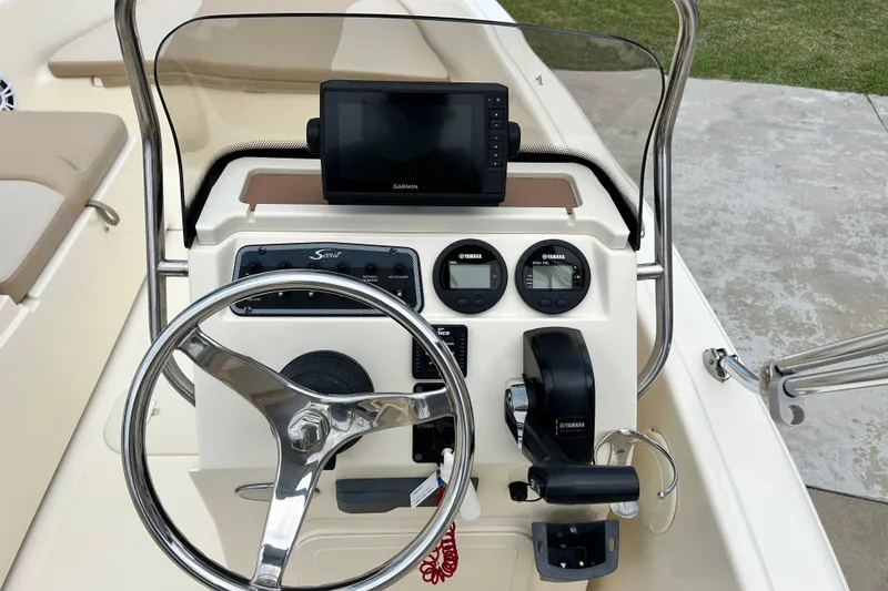 Slide: The Image of 2021 Scout 175 Dorado boat dashboard with Garmin display and Yamaha controls. - 15