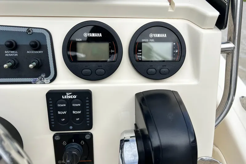 Slide: The Image of Control panel of 2021 Scout 175 Dorado boat with Yamaha gauges and Lenco trim tabs. - 17
