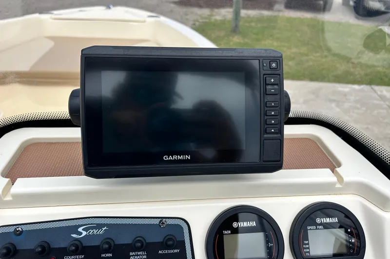 Slide: The Image of 2021 Scout 175 Dorado dashboard with Garmin display and Yamaha gauges. - 18