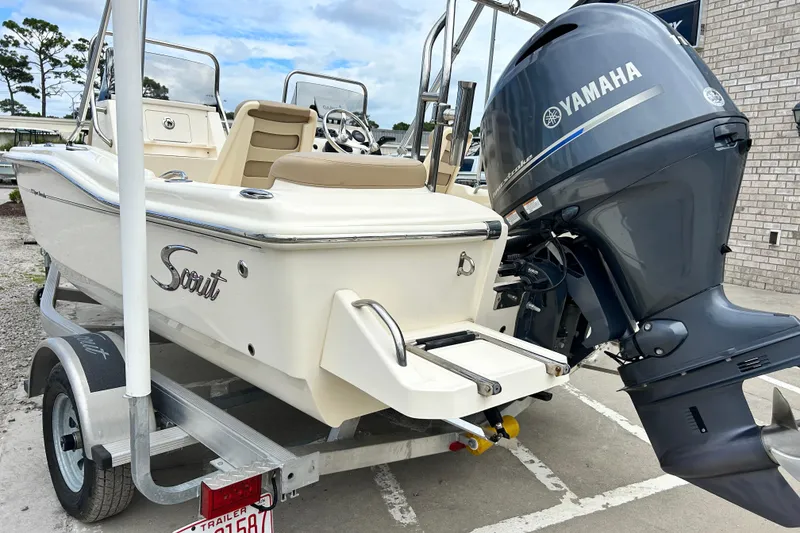 Slide: The Image of 2021 Scout 175 Dorado boat with Yamaha outboard motor on trailer. - 2