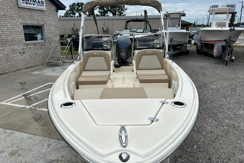 Slide: The Image of 2021 Scout 175 Dorado boat with seating, displayed at a dealership. - 7