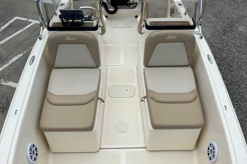 Slide: The Image of 2021 Scout 175 Dorado boat interior with beige seating and console. - 8