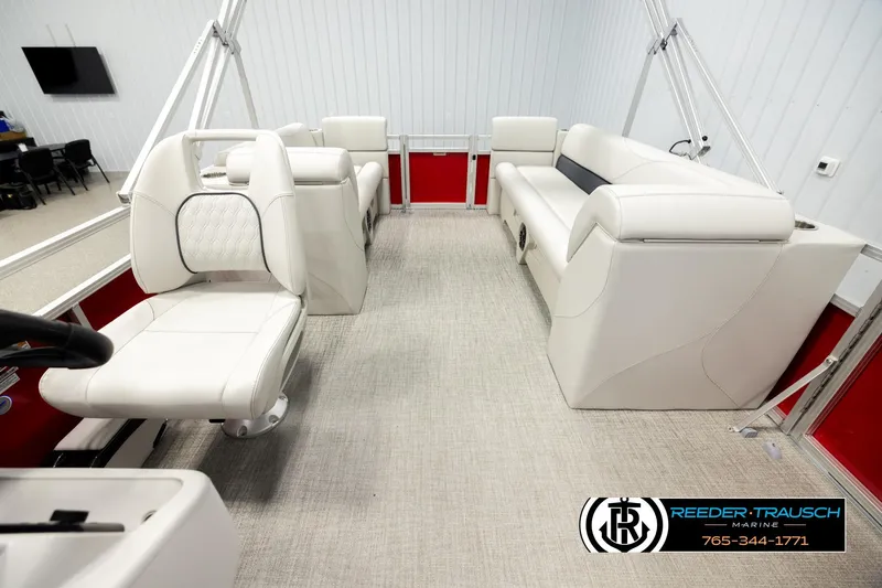 Slide: The Image of Interior of 2026 Avalon VLS QL pontoon boat with white seating and red accents. - 14