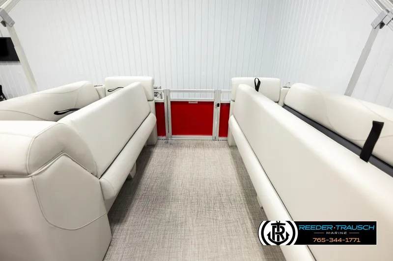 Slide: The Image of Interior of 2026 Avalon VLS QL boat with white seating and red door accent. - 16
