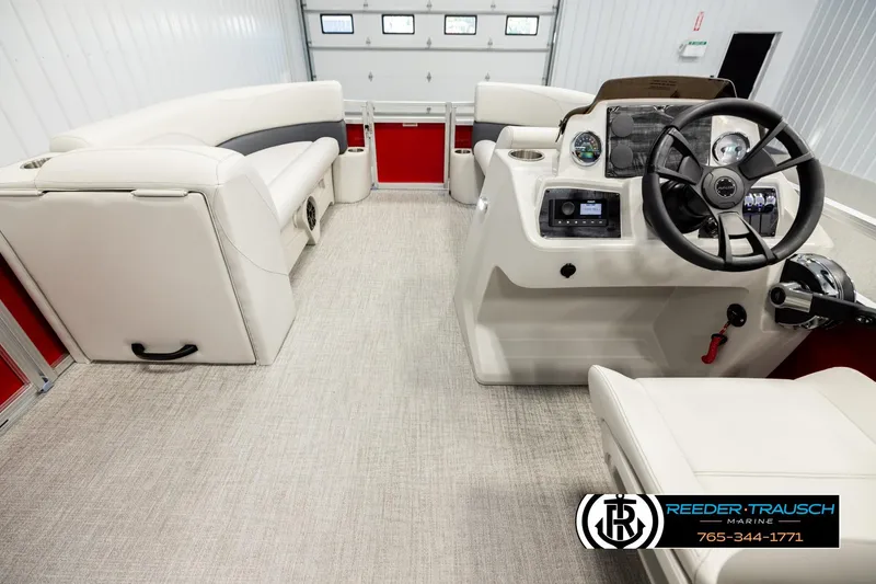 Slide: The Image of 2026 Avalon VLS QL boat interior with steering console and plush seating. - 18