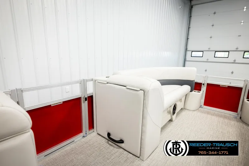 Slide: The Image of 2026 Avalon VLS QL boat interior with white seating and red panel accents. - 21