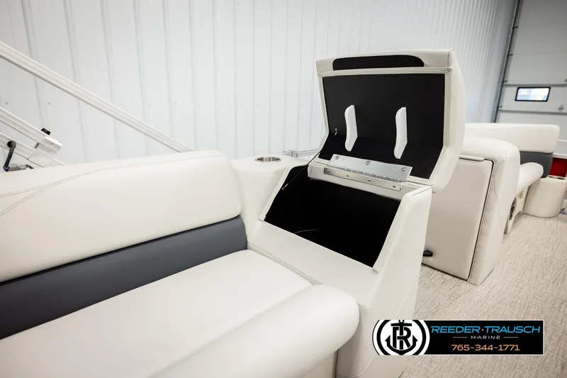 Slide: The Image of 2026 Avalon VLS QL boat interior with open storage compartment and white seating. - 24