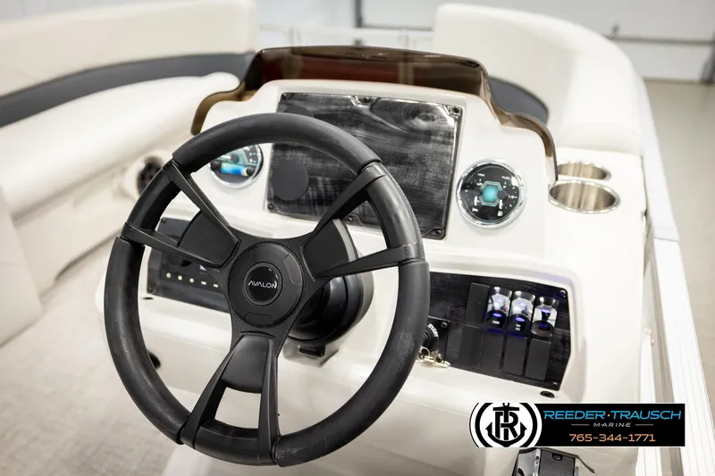 Slide: The Image of Steering wheel and dashboard of 2026 Avalon VLS QL boat, featuring modern controls. - 27