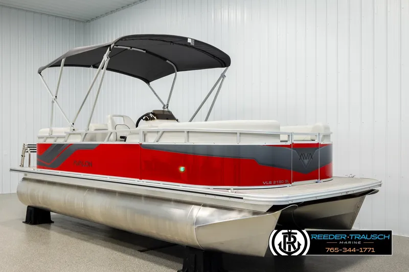 Slide: The Image of 2026 Avalon VLS QL pontoon boat with red and gray design, displayed indoors. - 3