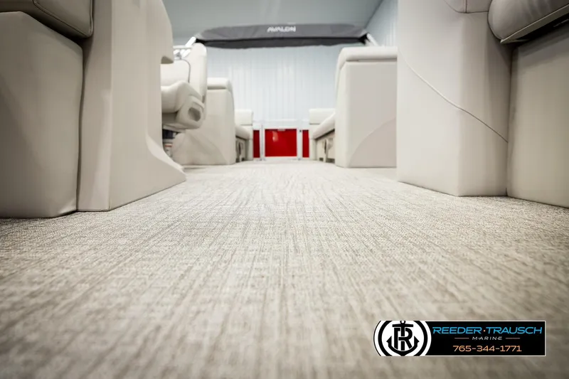 Slide: The Image of Luxurious interior of 2026 Avalon VLS QL boat with plush seating and carpeted flooring. - 39