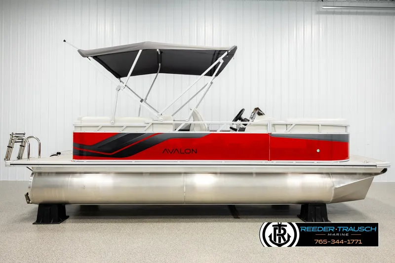 Slide: The Image of 2026 Avalon VLS QL pontoon boat with red and gray design, displayed indoors. - 5