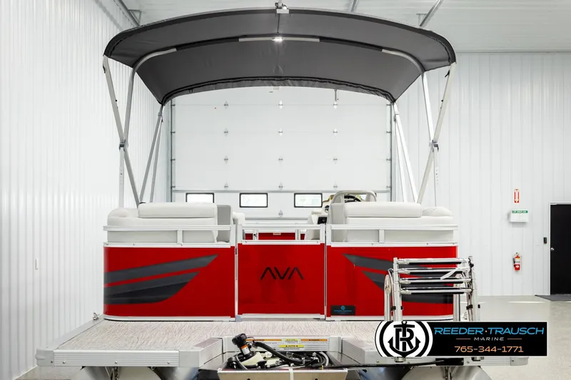 Slide: The Image of Red 2026 Avalon VLS QL pontoon boat in a showroom with canopy. - 7