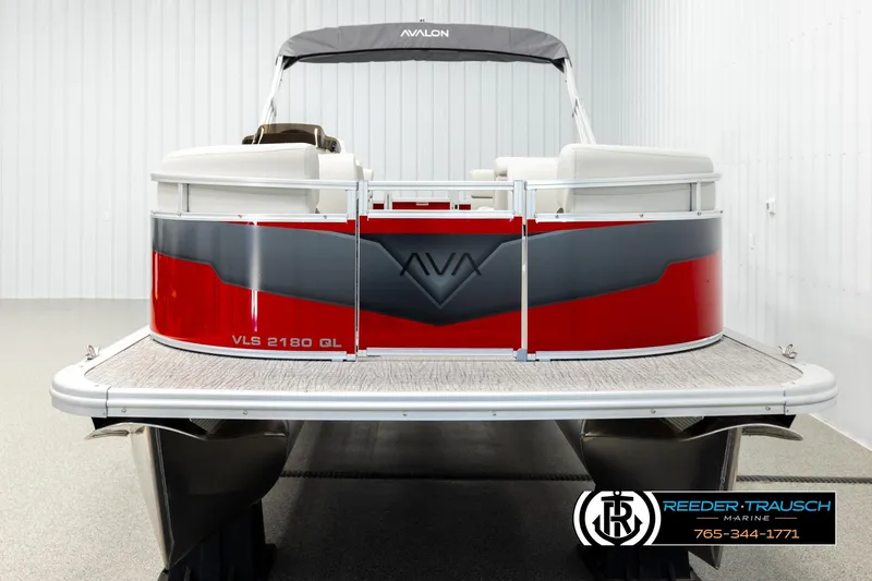Slide: The Image of 2026 Avalon VLS QL pontoon boat, red and gray design, displayed indoors. - 8