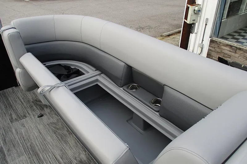 Slide: The Image of 2026 Bentley Pontoons Legacy 240 Navigator interior with gray seating and cup holders. - 16