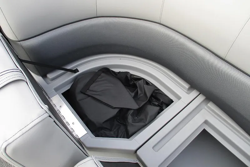 Slide: The Image of 2026 Bentley Pontoons Legacy 240 Navigator storage compartment with black cover. - 18