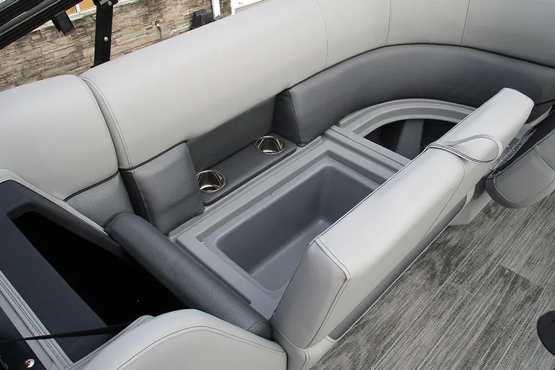 Slide: The Image of 2026 Bentley Pontoons Legacy 240 Navigator interior seating with built-in storage and cup holders. - 25