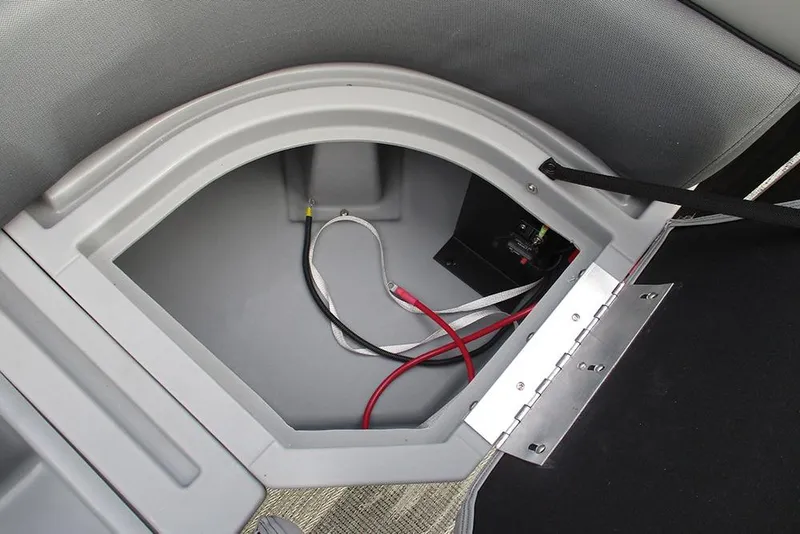 Slide: The Image of 2026 Bentley Pontoons Legacy 240 Navigator storage compartment with wiring and hinge detail. - 28