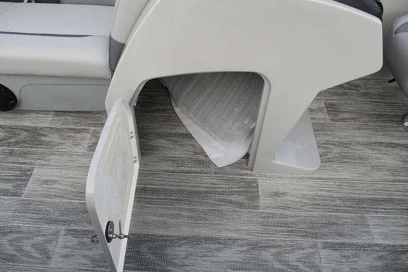 Slide: The Image of Open storage compartment on 2026 Bentley Pontoons Legacy 240 Navigator boat. - 30