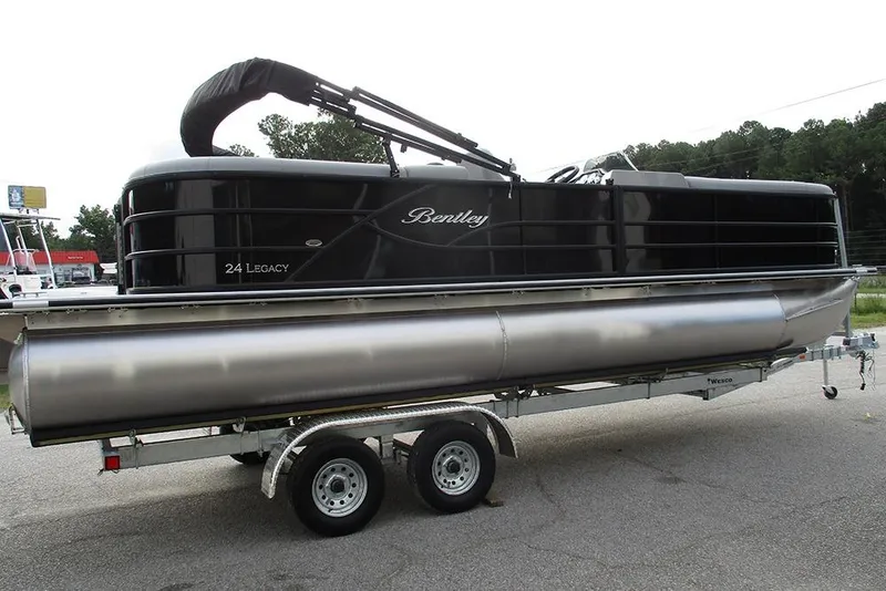 Slide: The Image of 2026 Bentley Pontoons Legacy 240 Navigator on trailer, sleek black design. - 6