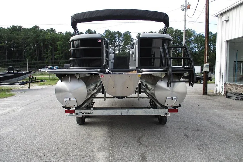 Slide: The Image of 2026 Bentley Pontoons Legacy 240 Navigator on trailer, rear view, outdoor setting. - 8