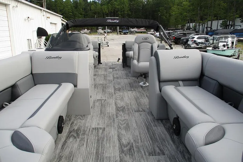 Slide: The Image of 2026 Bentley Pontoons Legacy 240 Navigator interior with luxurious seating and modern design. - 9