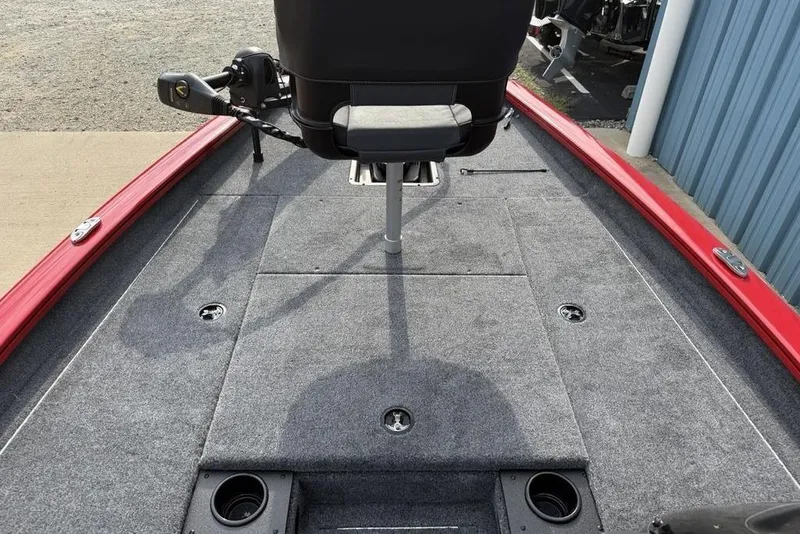 Slide: The Image of 2026 Tracker Pro Team 175 boat deck with gray carpet and red trim. - 10