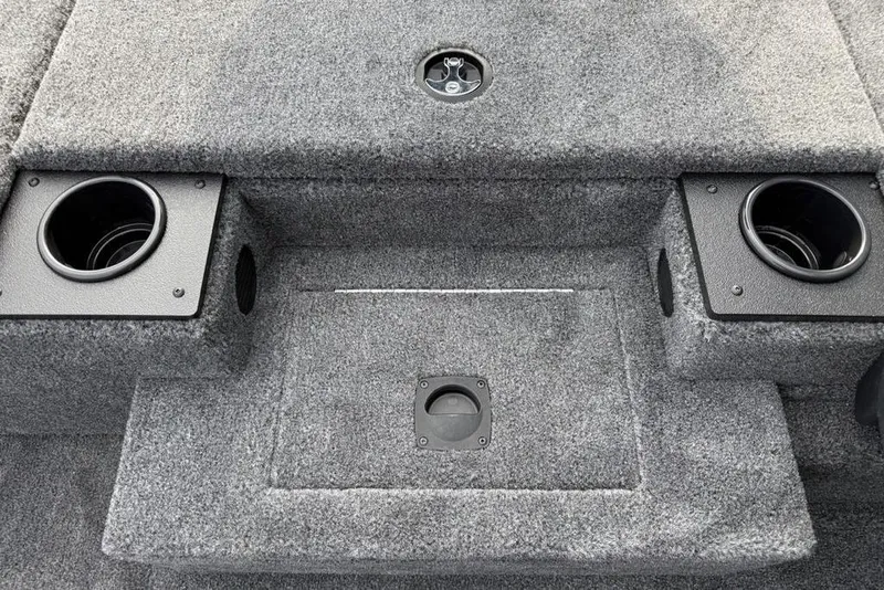 Slide: The Image of Interior of 2026 Tracker Pro Team 175 boat with carpeted flooring and cup holders. - 11