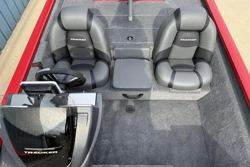 Slide: The Image of 2026 Tracker Pro Team 175 boat interior with dual gray seats and steering console. - 12