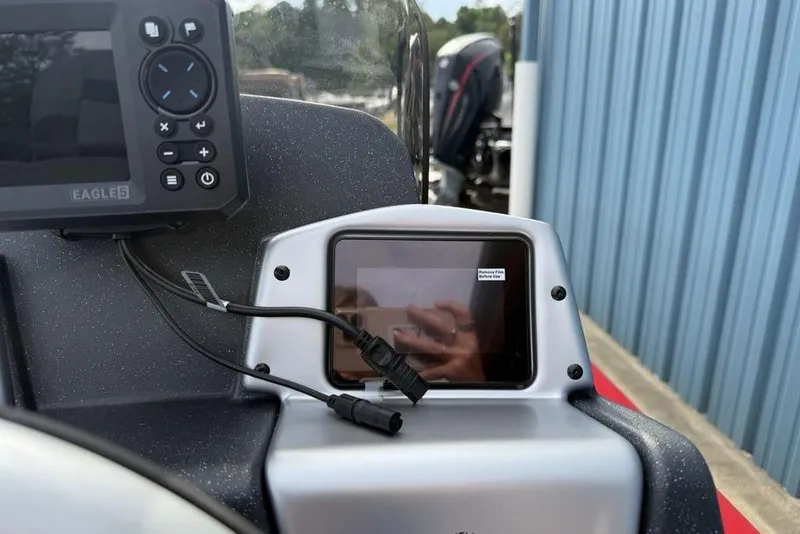 Slide: The Image of Control panel of 2026 Tracker Pro Team 175 boat with electronic display and controls. - 15