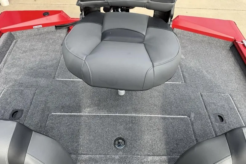 Slide: The Image of 2026 Tracker Pro Team 175 boat interior with gray seating and carpeted deck. - 18