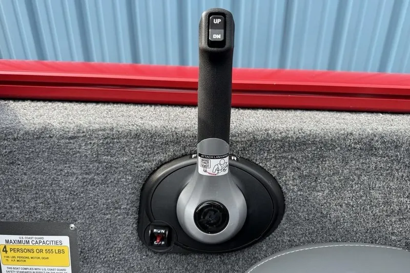 Slide: The Image of Throttle control lever on 2026 Tracker Pro Team 175 boat interior. - 21