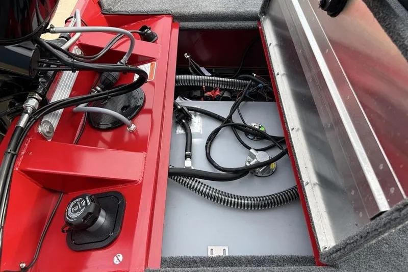 Slide: The Image of 2026 Tracker Pro Team 175 boat interior showing fuel system and wiring components. - 23