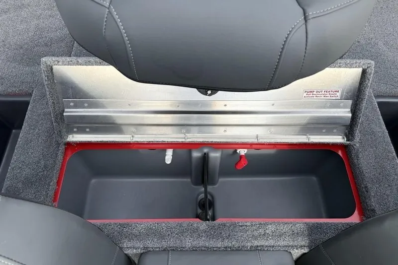 Slide: The Image of Open storage compartment in 2026 Tracker Pro Team 175 boat, featuring pump-out feature. - 25