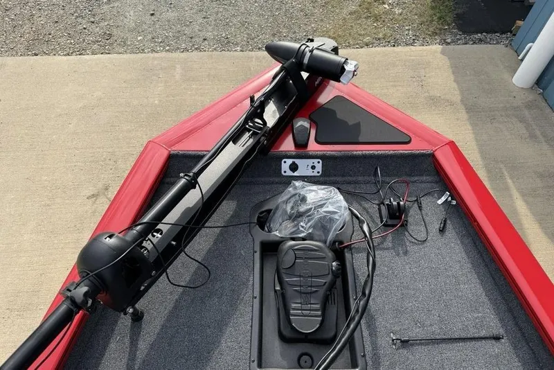 Slide: The Image of 2026 Tracker Pro Team 175 boat deck with trolling motor and foot pedal controls. - 4