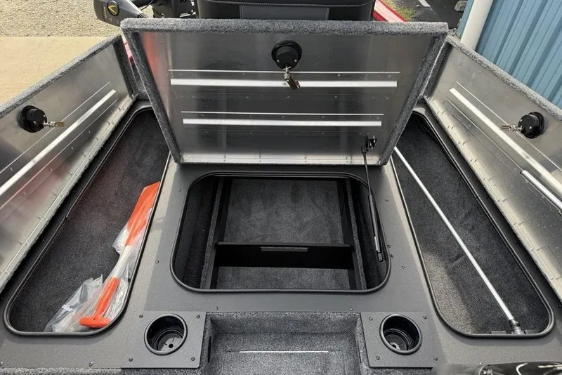 Slide: The Image of 2026 Tracker Pro Team 175 boat storage compartments open, revealing spacious interior. - 8
