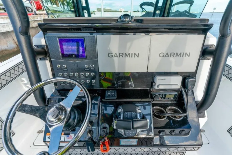 Slide: The Image of Dashboard of 2021 Wellcraft 302 Scarab boat with Garmin navigation systems. - 4