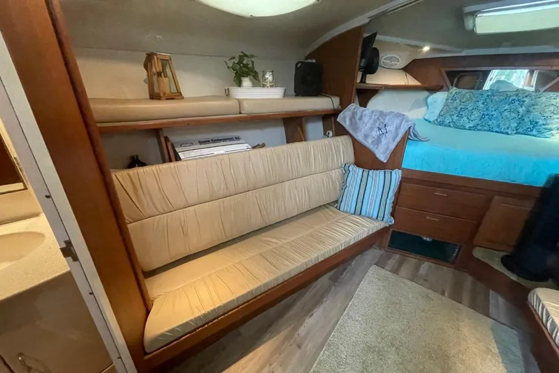 Slide: The Image of Interior of 1997 Luhrs 36 SX boat with cozy seating and bed area. - 13