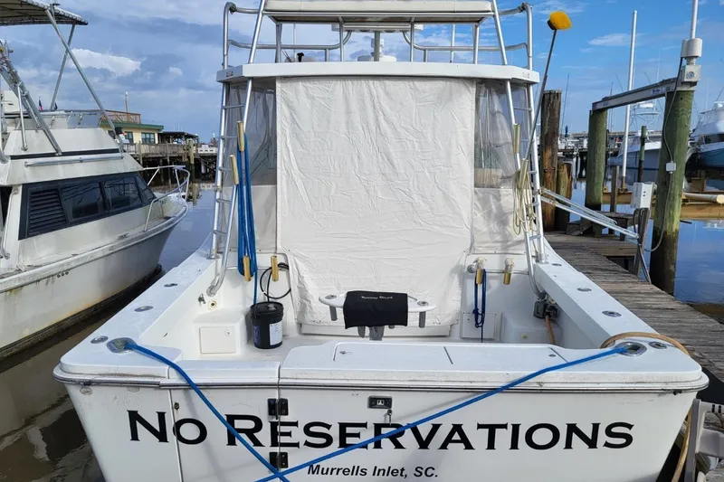 Slide: The Image of 1997 Luhrs 36 SX boat named "No Reservations" docked at Murrells Inlet, SC. - 2