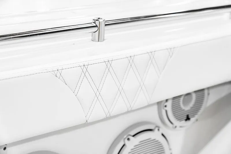 Slide: The Image of 2026 Contender 28 Tournament boat interior with diamond-stitched upholstery and stainless steel railing. - 10
