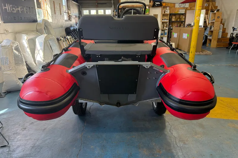 Slide: The Image of 2023 Highfield Classic 380 FCT inflatable boat in a showroom, rear view. - 2