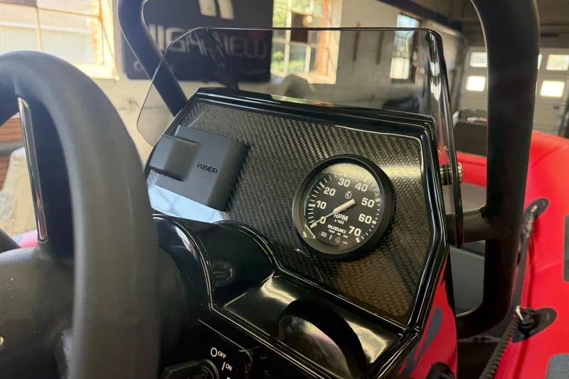 Slide: The Image of 2023 Highfield Classic 380 FCT dashboard with RPM gauge and Fusion audio system. - 7