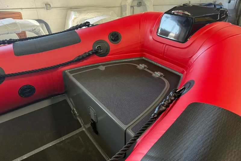 Slide: The Image of 2023 Highfield Classic 380 FCT inflatable boat interior with red and black design. - 8